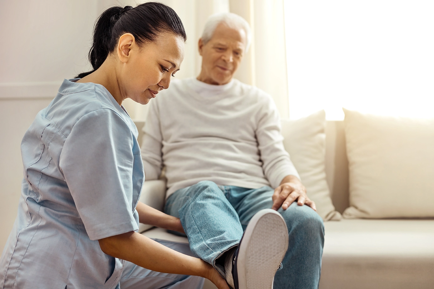 Healthcare professional helping a patient
